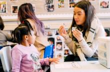 Photo of a student and teacher at the Haring Center, part of UW Pediatric's IHDD